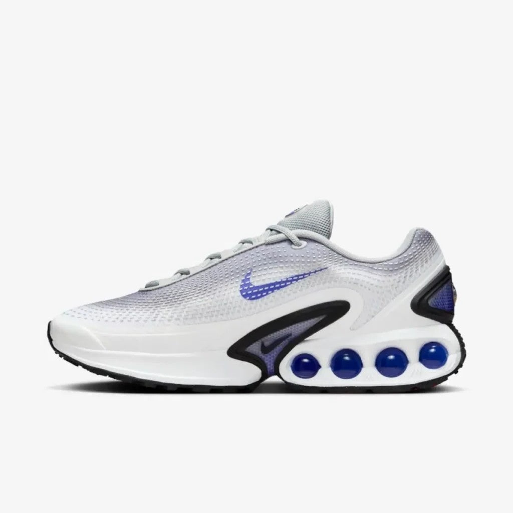 The Nike Air Max Dn "Light Smoke Grey and Persian Violet image showing the purple violet swoosh