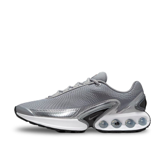 Nike Air Max Dn Metallic Silver Main product image showing the Silver and gret upper suspended by a white rubber sole with 4 air bubbles.