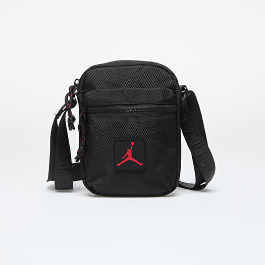 Product image showing the Jordan Rise Festival Side Bag in a Black Polyester and a red Jumpman Jordan Logo