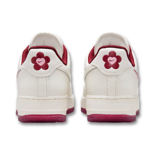 Back view of Nike Air Force 1 Valentine's Day with custom floral logo on the heel tab in pink and red accents.