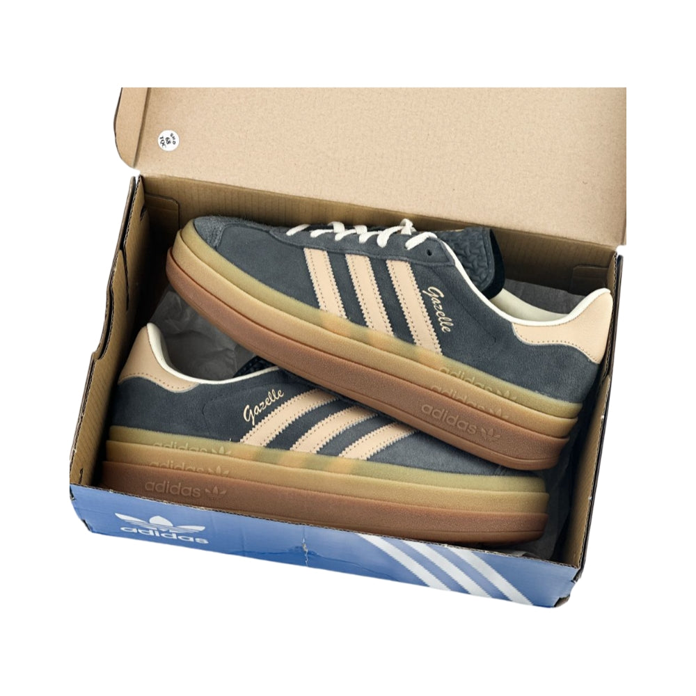 aerial view of Adidas Gazelle Bold Grey Magic sneakers inside box, highlighting the triple-layer gum rubber sole and stylish grey suede upper.