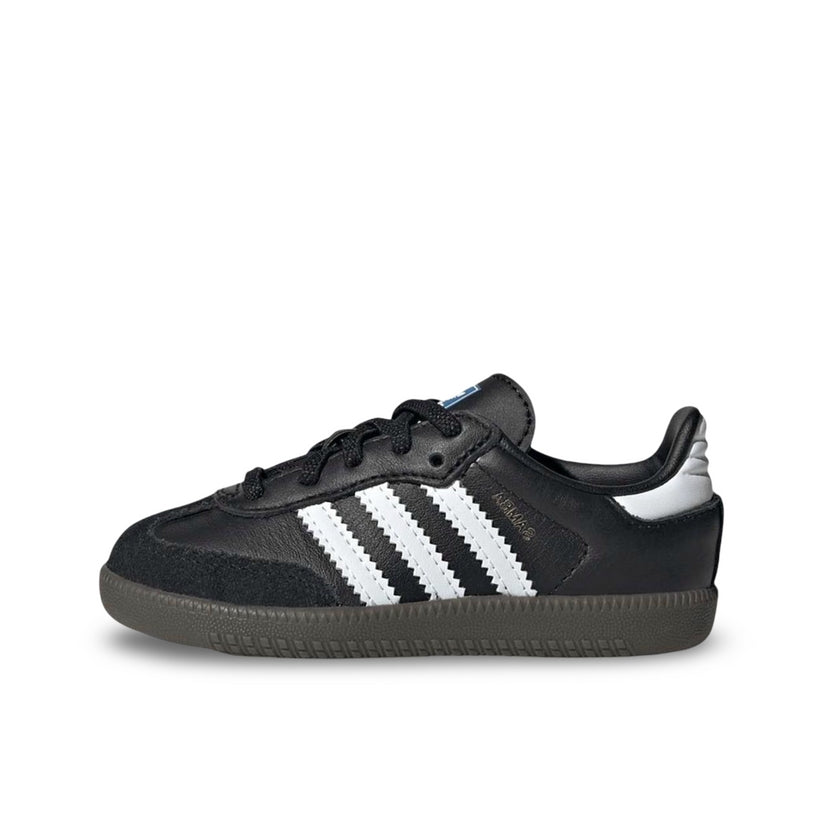 Adidas Samba OG kids in Core Black. Showing white stripes and black Leather with suede on toe box. A dark brown sole.