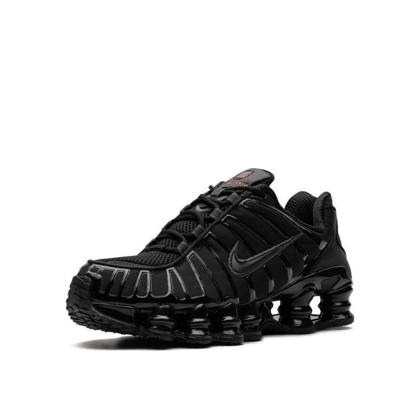 Side angle shot of the Nike Shox TL All Black, emphasizing its modern silhouette and the iconic Shox cushioning system that adds both style and performance