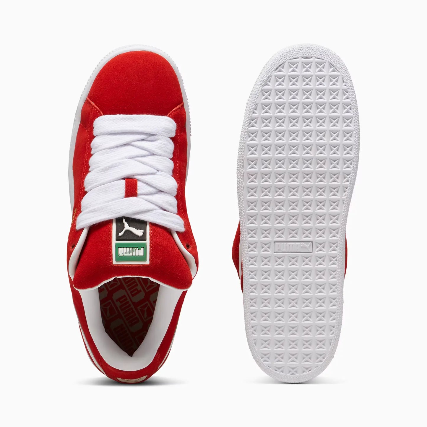 Red and white Puma Suede XL sneakers showing the all white undersole with 4 pin stars.