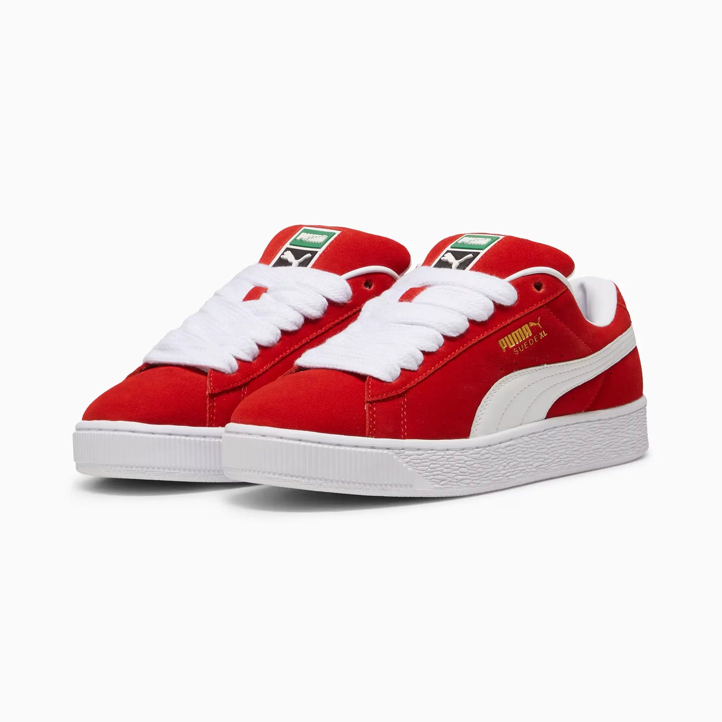 Stylish red suede Puma Suede XL sneakers with a padded upper, white laces, and gold branding on the side.