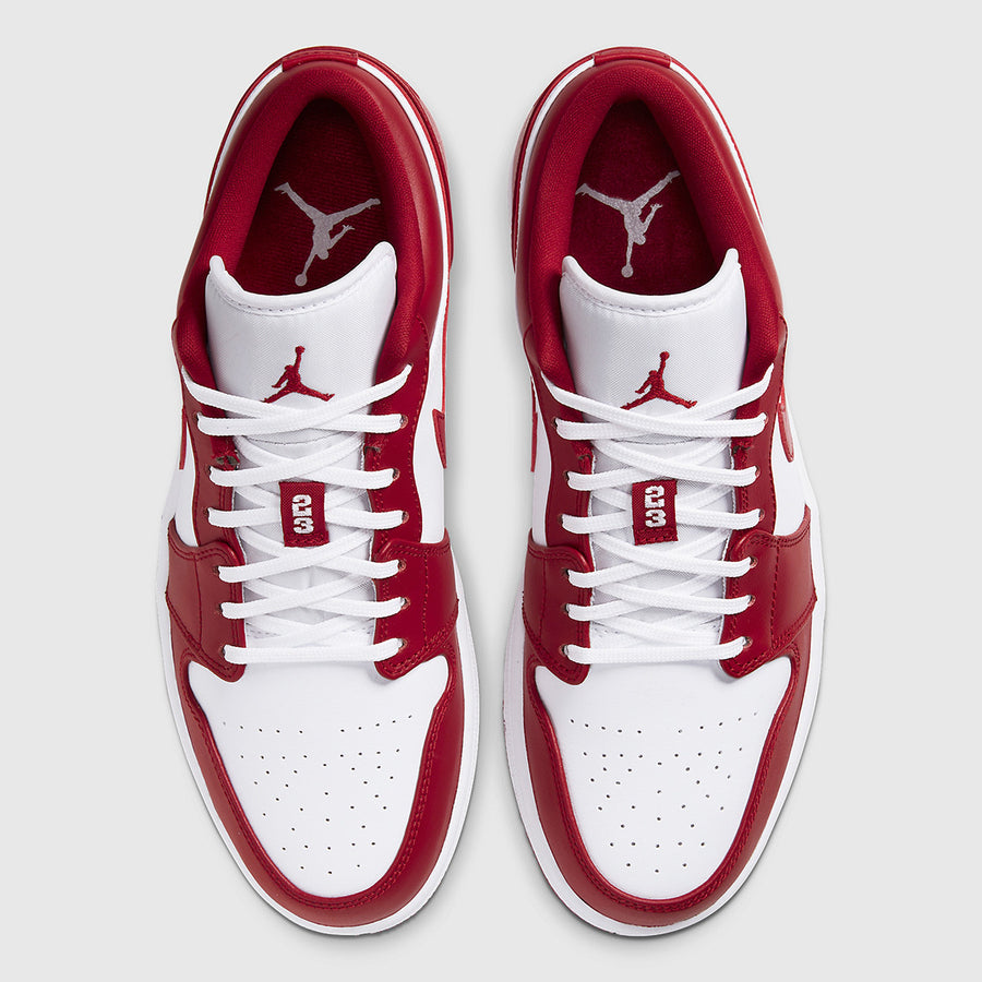 Men's Air Jordan 1 Low "New Beginnings" in Gym Red and White, featuring a classic silhouette, premium leather upper, and number 23 on the tongue for added style.