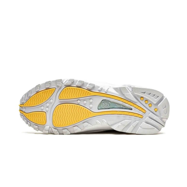 Undersole of the Nike x Drake Collab on Nocta, showing the yellow and white color mix. 