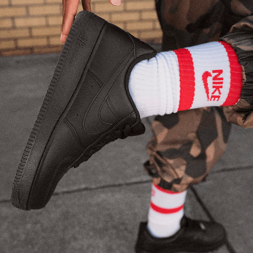 Air Force 1 Black with White and red nike socks and a camo cargo.