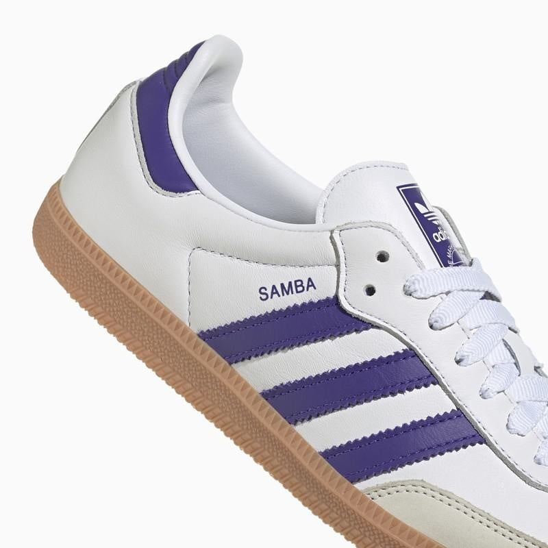 Side view of adidas Men's Samba OG White with Purple Stripes, showcasing leather, suede, and iconic gum sole with serrated 3-Stripes for comfort and flair.