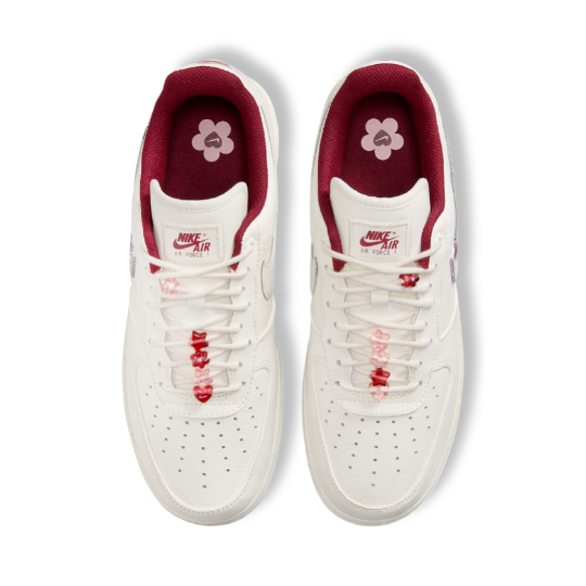 Top view of Nike Air Force 1 Valentine's Day highlighting custom floral logo on the insoles and pink-red color details.